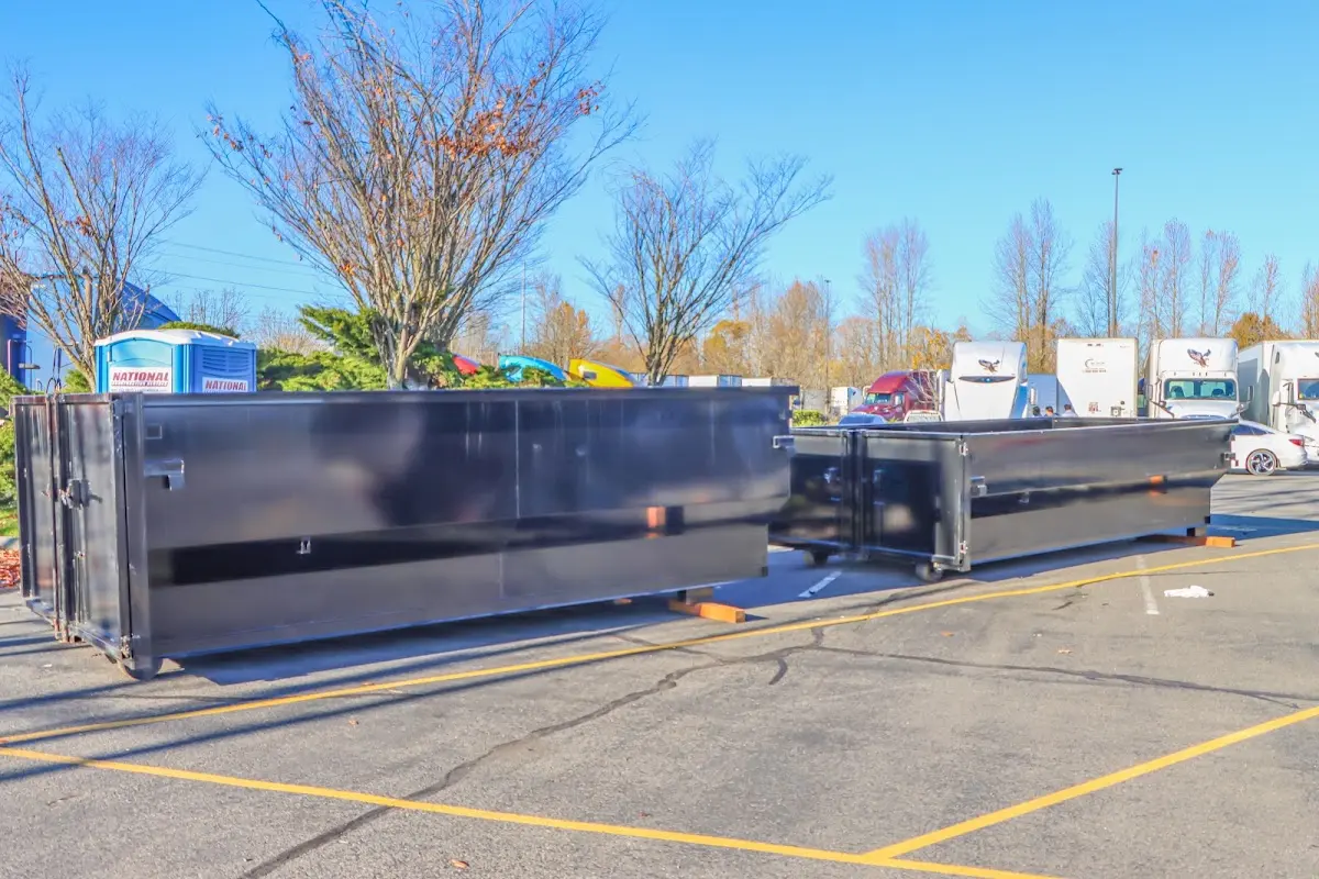 Professional dumpster rental service with roll-off container on residential driveway in Rotonda